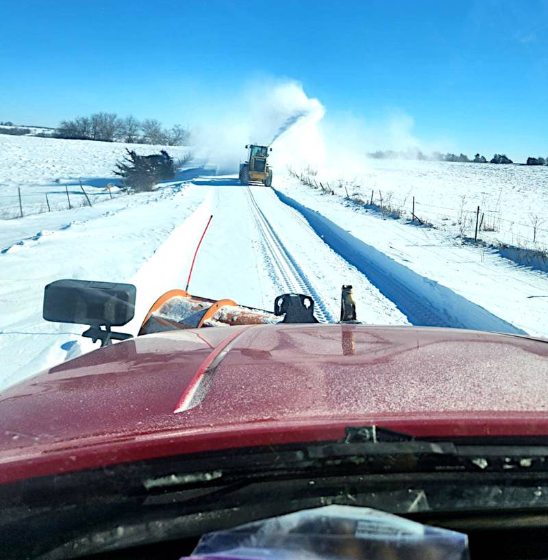 Union County Secondary Roads crews work their way down a road after the heavy snow and wind earlier this month. The county is considering finding a more efficient way for residents to notify the crews about the condition of their road after snow events.