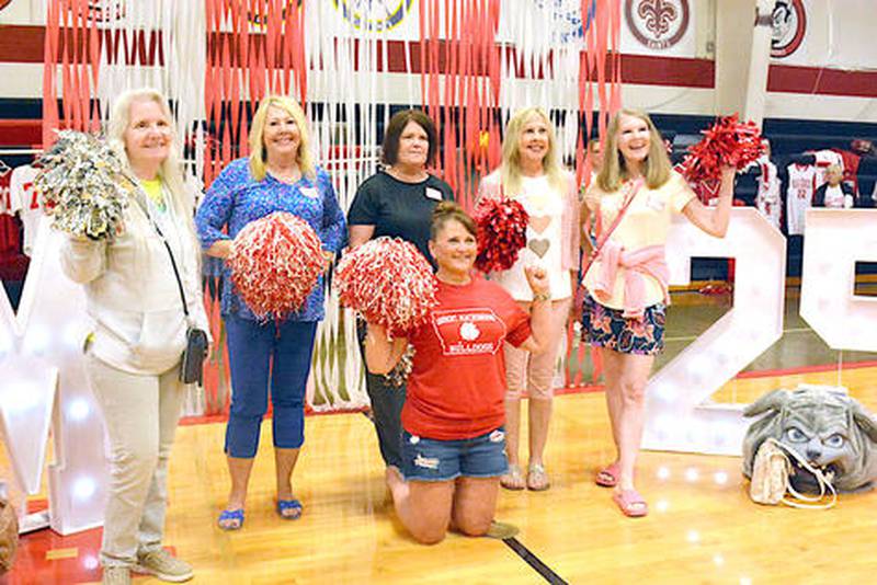 Former Orient-Macksburg cheerleaders, back row, from left: Eileen Vaughan Turner, Ronda Libby Waltz, Jackie Kingery Wyant, Debbie Libby Taylor, Laura Thompson Forrett and in front, Peni Huddleson Tussey, pose for a photo at a farewell event hosted by a group of alumni Saturday at the school.