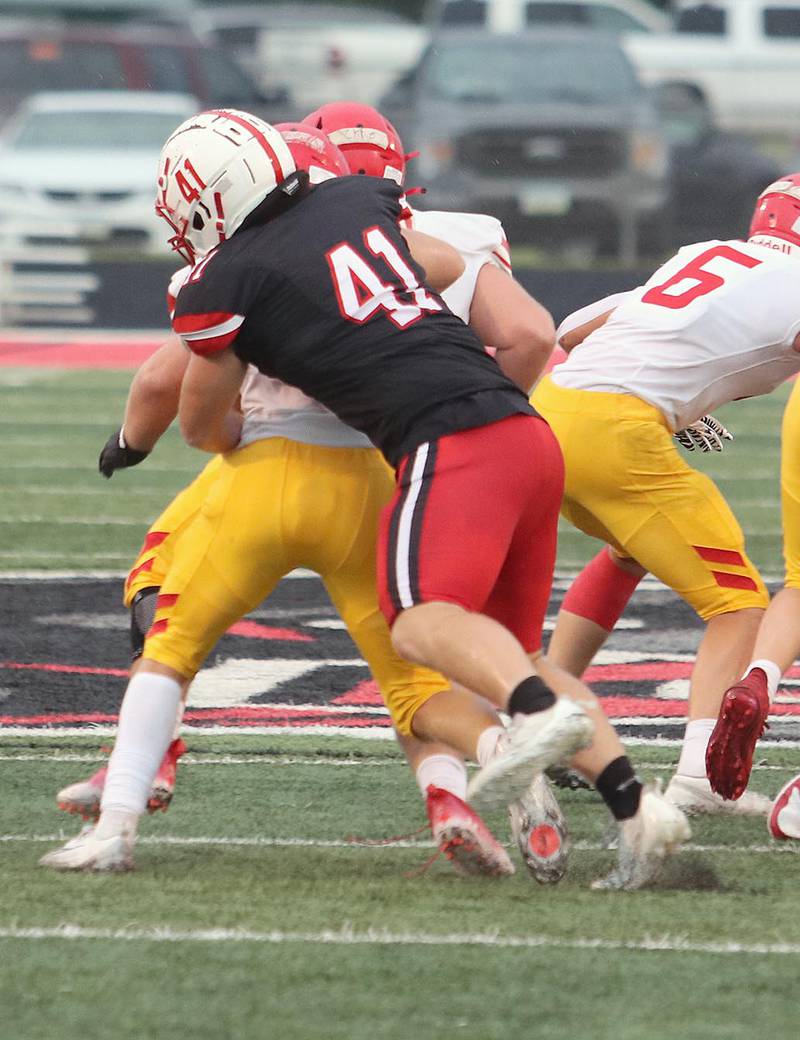 Creston's Tom Mikkelsen makes a tackle during Friday's scrimmage against Carlisle. Mikkelsen, an all-district defensive lineman last year, is moving to inside linebacker this season for the Panther defense.