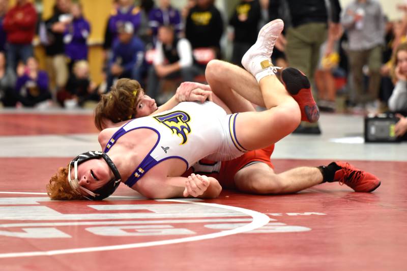 Christian Ahrens (120) gets back points on Isaiah Madison of Johnston Saturday in the semi-finals at the Andy Davidson DCG Mustangs Invite in Grimes. Ahrens won the match with a 15-0 tech fall to advance to the finals where he took second.