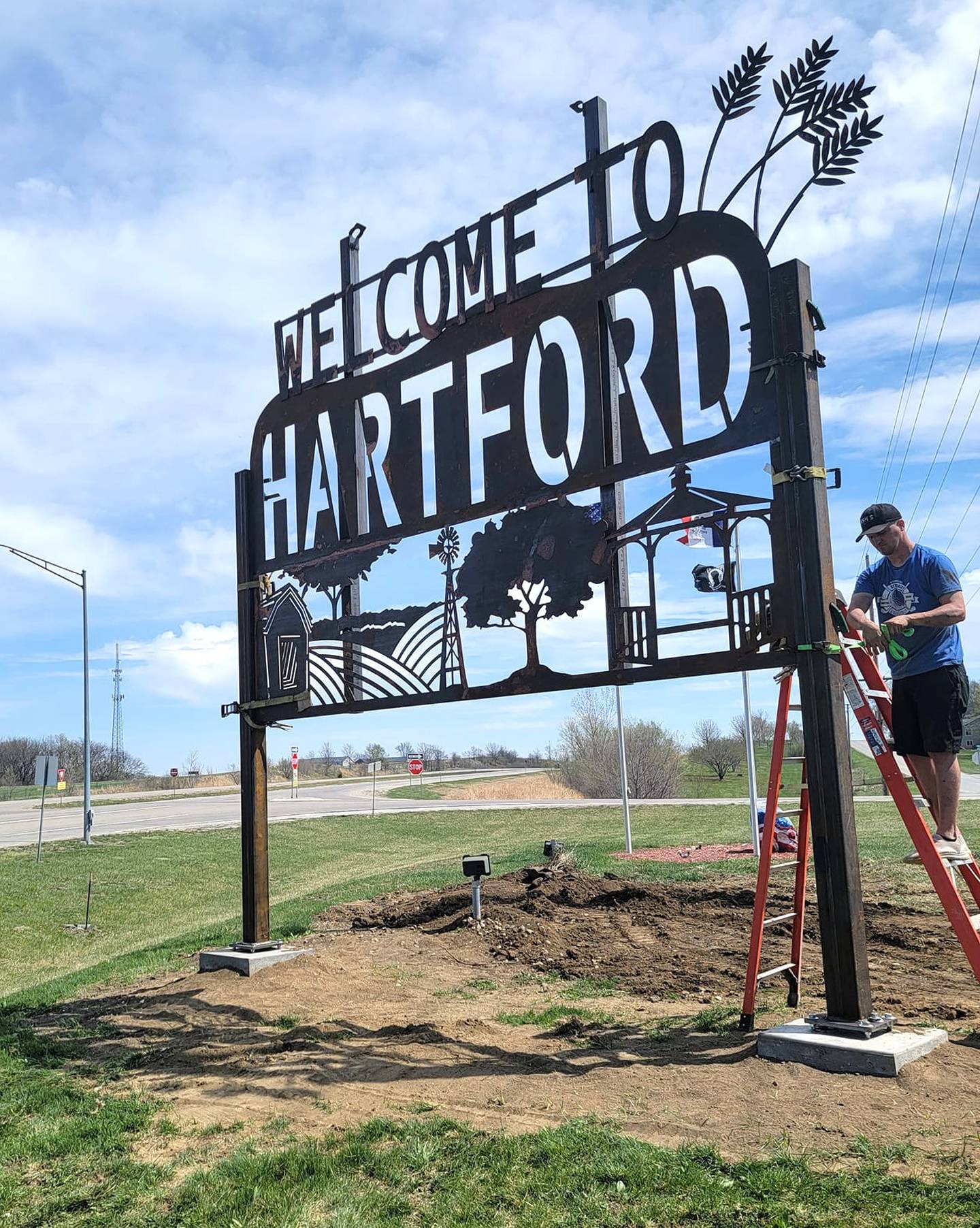 Hartford's Hometown Pride Committee purchased a new sign welcoming people to town through the program.