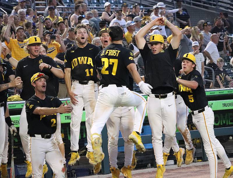 Iowa third baseman Jaixen Frost of Mount Ayr simulates a dunk as part of Iowa's home run celebration tradition. Frost's two-run homer gave Iowa a 14-5 lead in the eighth inning Friday night as part of a three-game sweep of Purdue at Principal Park.