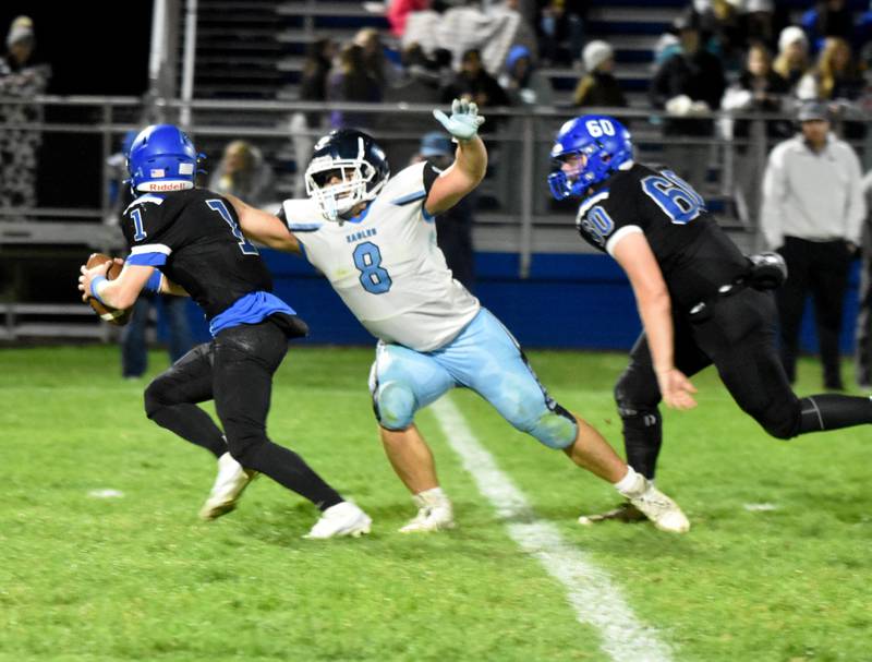 East Union’s Morgan Cooley (No. 8) breaks free to sack Montezuma quarterback Brady Boulton. Cooley had two tackles for loss Friday in the 46-28 playoff loss.