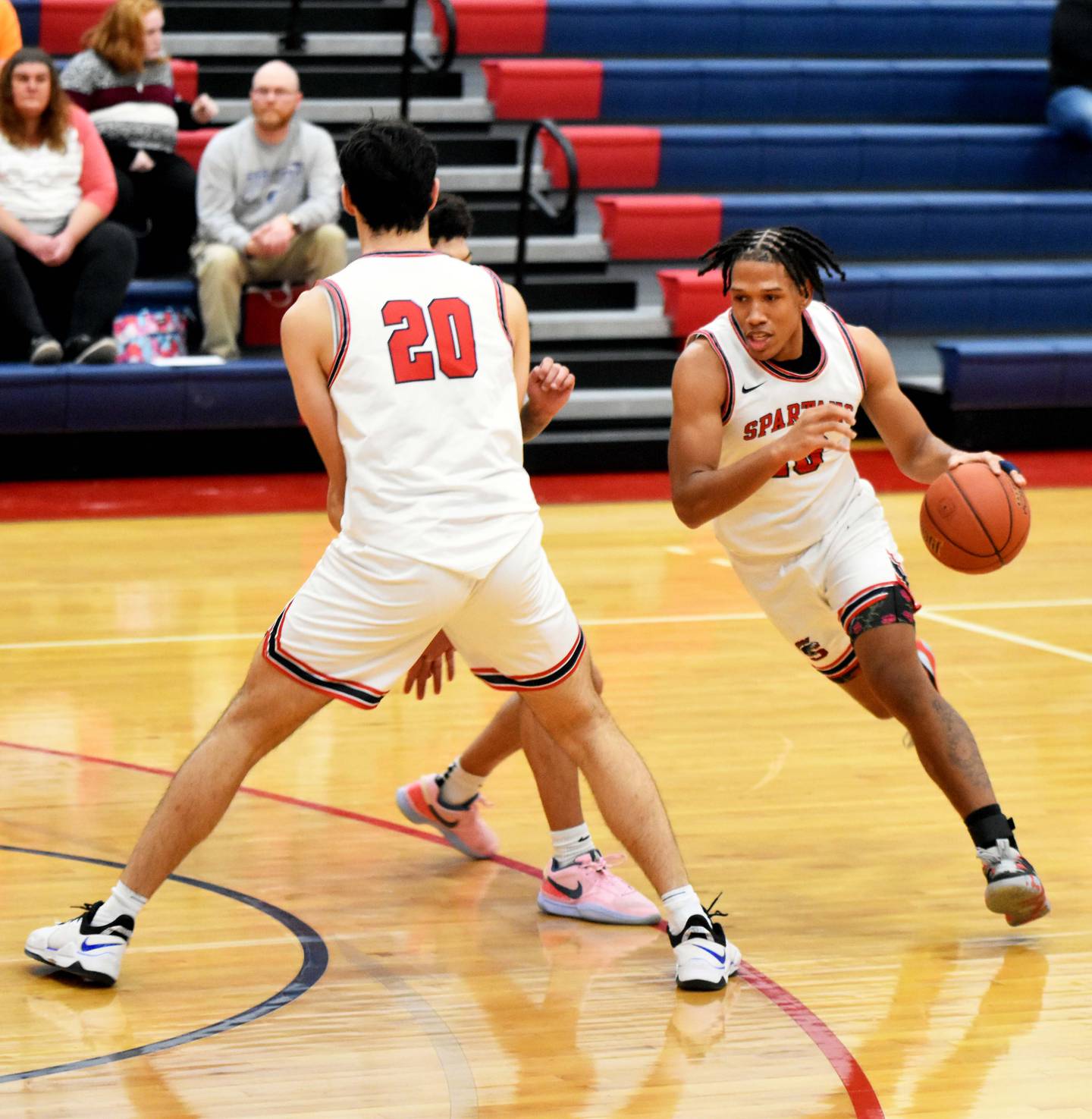 Fatih Huyuk (No. 20) sets a screen for Donnary Fontenot as he drives toward the basket. Fontenot had 13 points for the Spartans while Huyuk added seven.