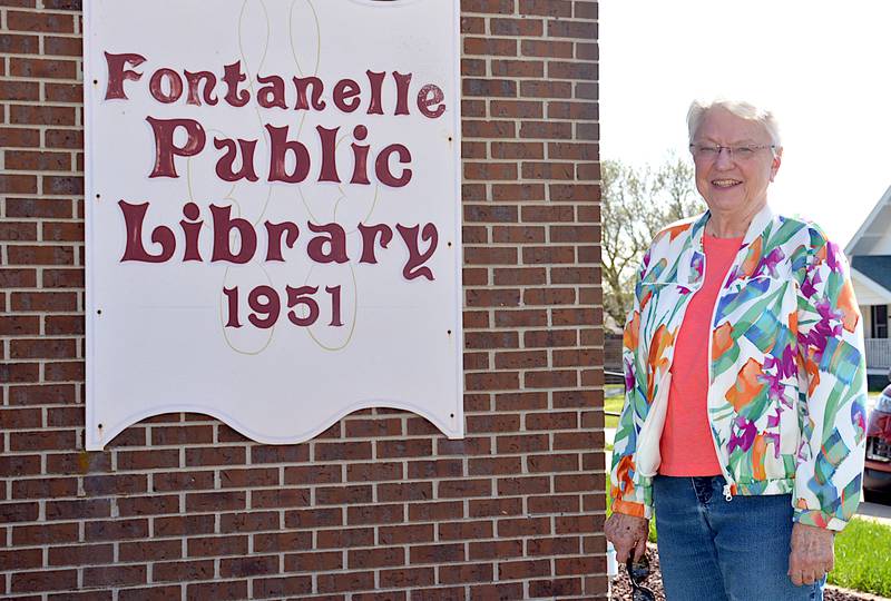 Lillian Nichols, a member of the Fontanelle Library Board since at least 1980, in front of the Fontanelle Public Library.