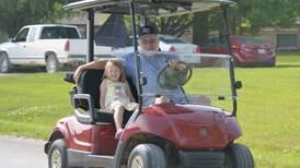 Golf carts cruise the streets of Afton