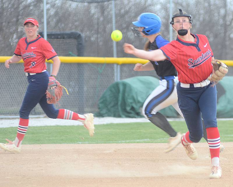Southwestern third baseman Joslyn Policky throws to first base after fielding a ground ball as shortstop Emma Moore backs up the play against DMACC Thursday.
