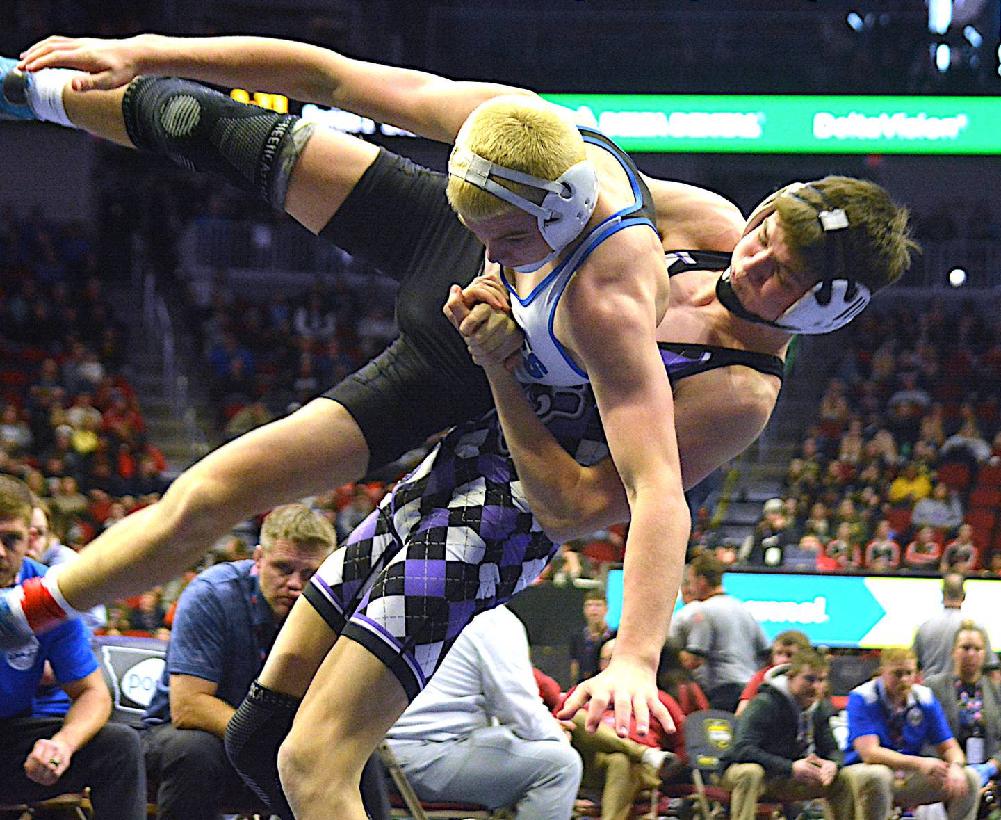 Senior 132-pounder Ty Strode lifts Underwood’s Ryan Fletcher from the mat during their bout at state.