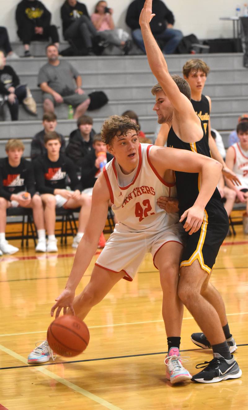 Jake Hoyt puts up a shot against Atlantic defenders. Hoyt led scoring with 23 points.