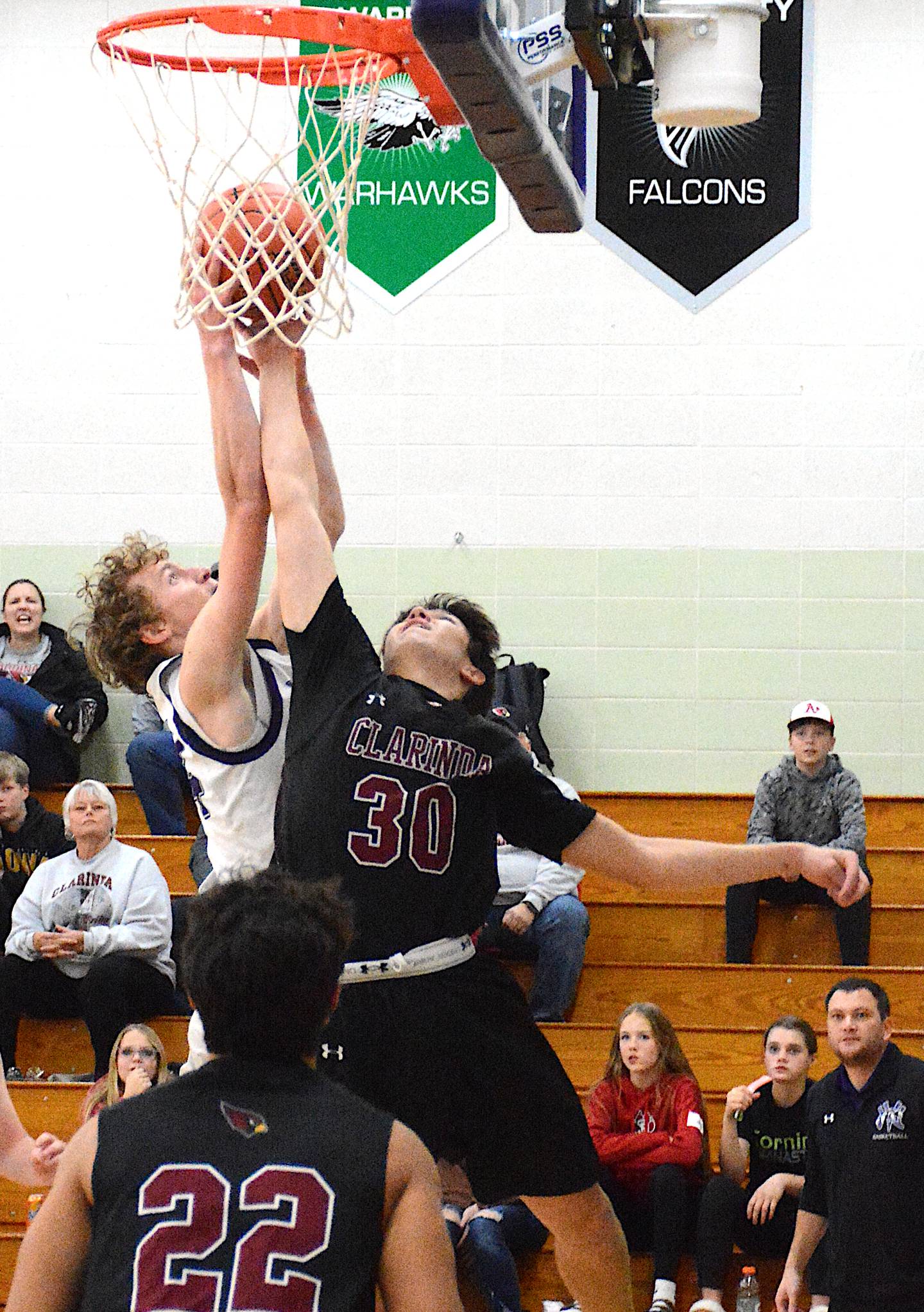 NV/OM's Paul Berg battles for a rebound against Clarinda Monday, Nov. 27 on the opening night of the boys hoops season.
