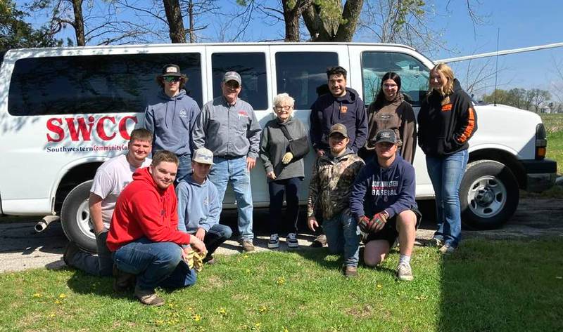 Southwestern Community College's Automotive Repair students took time during Pay It Forward week to cleanup the yard of Barbara Bills, the widow of the late auto program founder Gordon Bills.