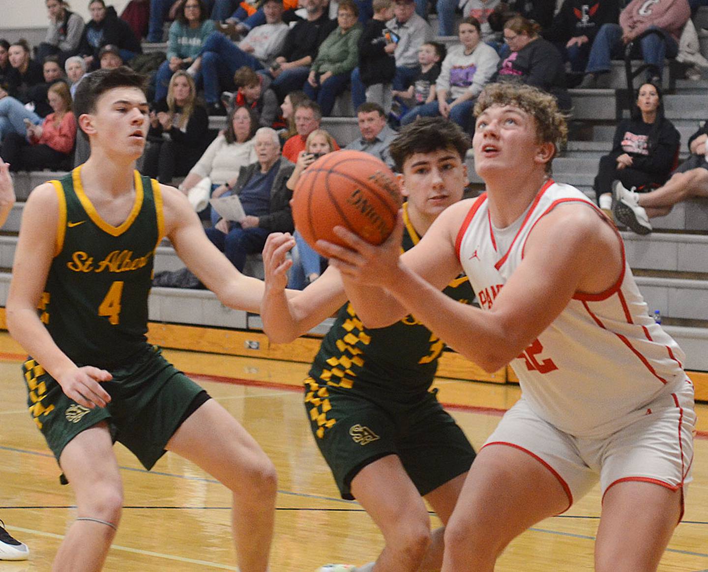 Creston center Brayden Schoon goes up for a shot in the lane against St. Albert Tuesday. Schoon scored 12 points for the Panthers.