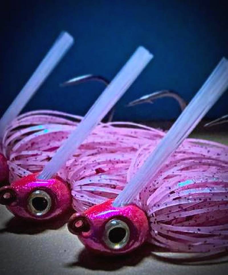Brightly colored swim jigs, which are extremely similar to spinner bait without the wire and blades. Swim jigs are a versatile, weedless and pointed-head jig designed for shallow-water bass fishing and are easier to at being retrieved through vegetation, lily pads and timber to imitate baitfish or bluegill.