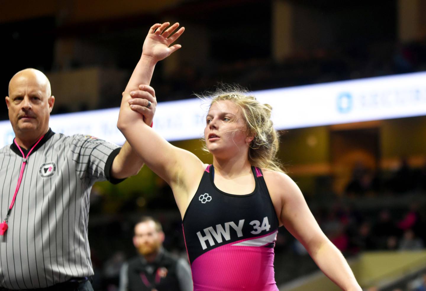 Evy Marlin of Creston is declared the winner of the 130 lbs finals bout against Nicole Bond of Red Oak at Regionals Friday in Sioux City. Highway 34 placed fourth and the team is sending four wrestlers to state