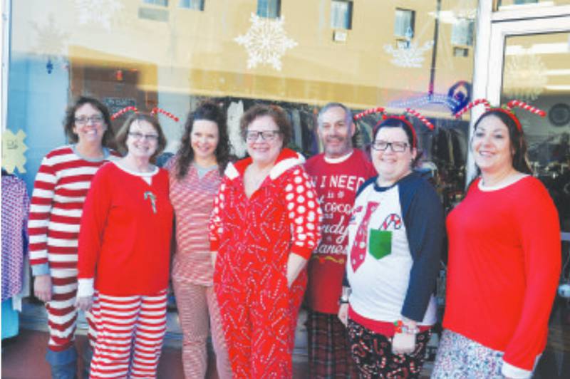 From left, Jan Ekeler, Becky Nardy, Erica Wolfe, Candy Cain, Dennis Nardy, Staci Pokorny and Ashley Abdulbaki. The Reclaimed Wardrobe opened early for Black Friday and encouraged shoppers to come browse the racks in their pajamas.