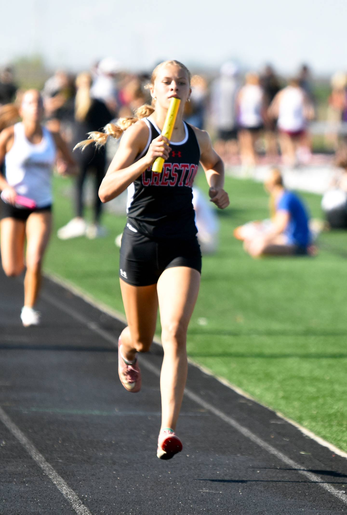 Cora Smith runs the third leg of the 4x800m relay. The girls posted a 9:50.53, their season-best time, for second place.