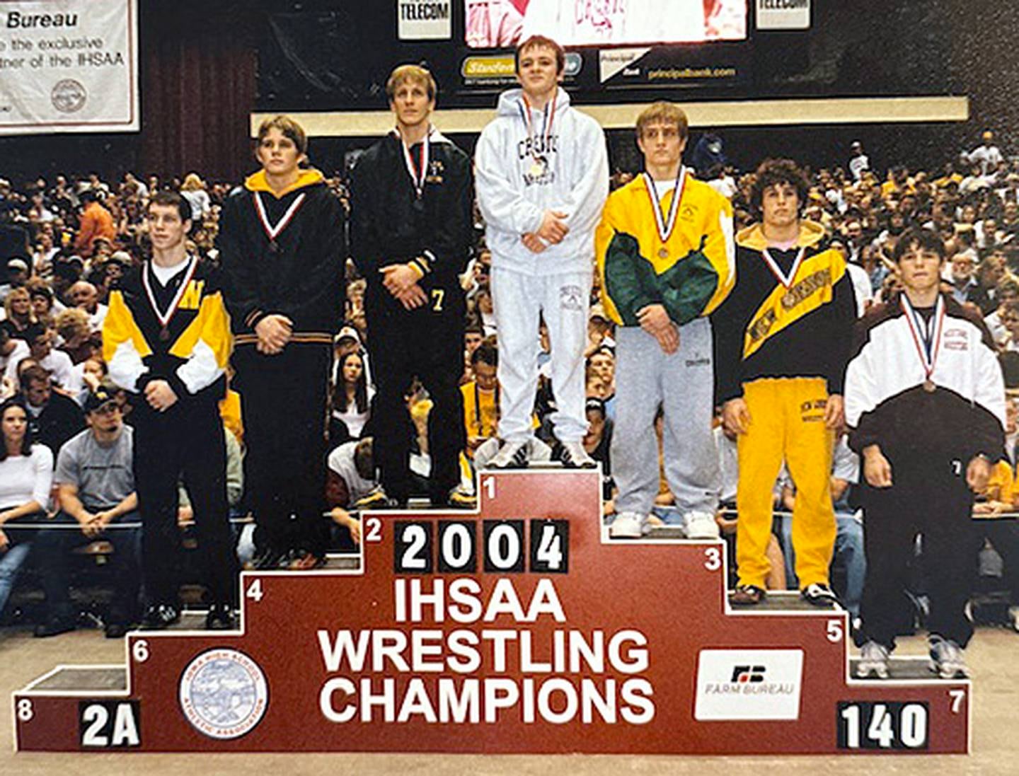 State champion Daniel Scarberry of Creston on the 140-pound medal stand in the 2004 state tournament at Veterans Memorial Auditorium.