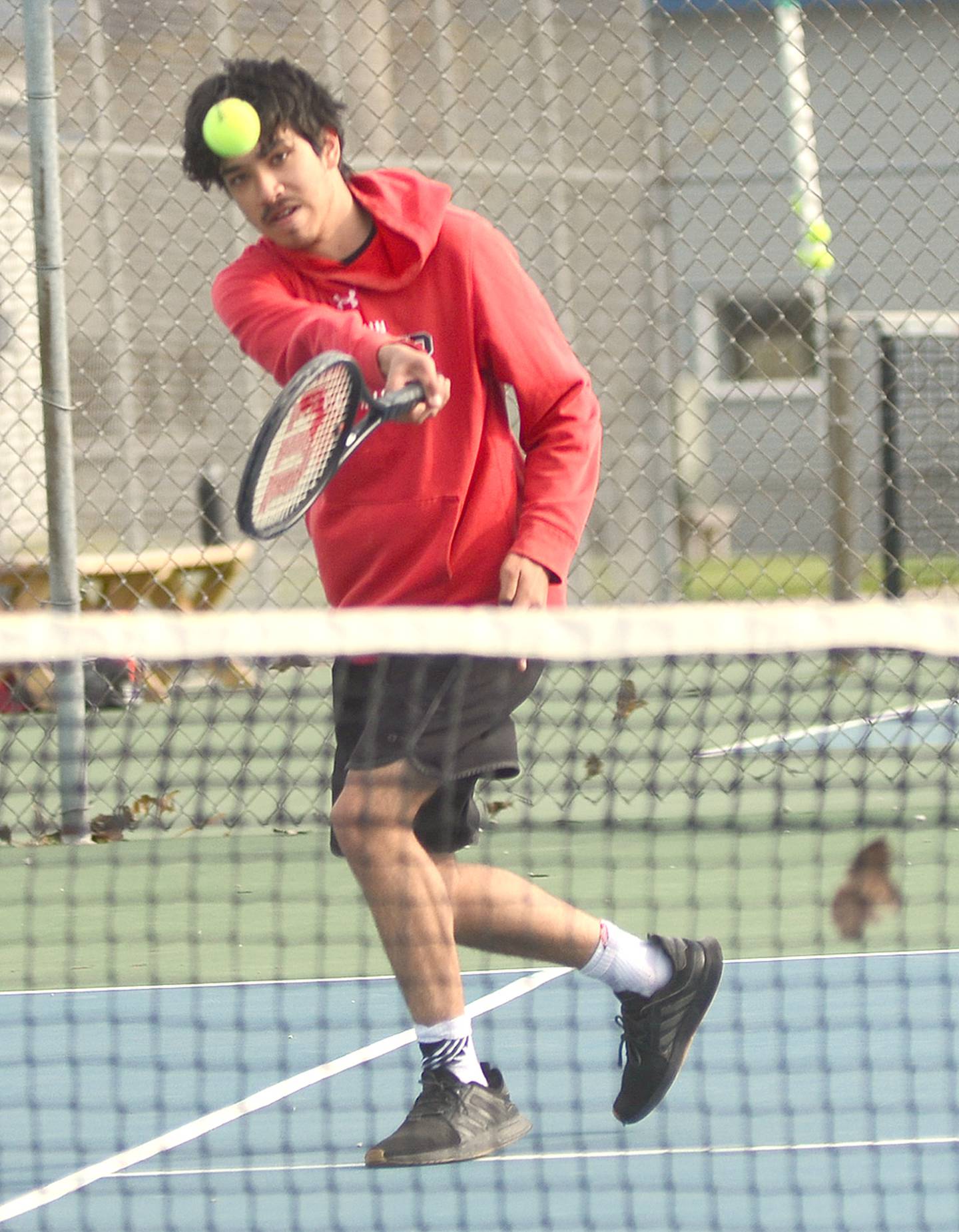 Ben Hill of Creston concentrates on a baseline return during his 8-6 singles win against Clarinda Monday. Hill and Damion Meyer were also doubles winners in the team's 6-3 dual victory.