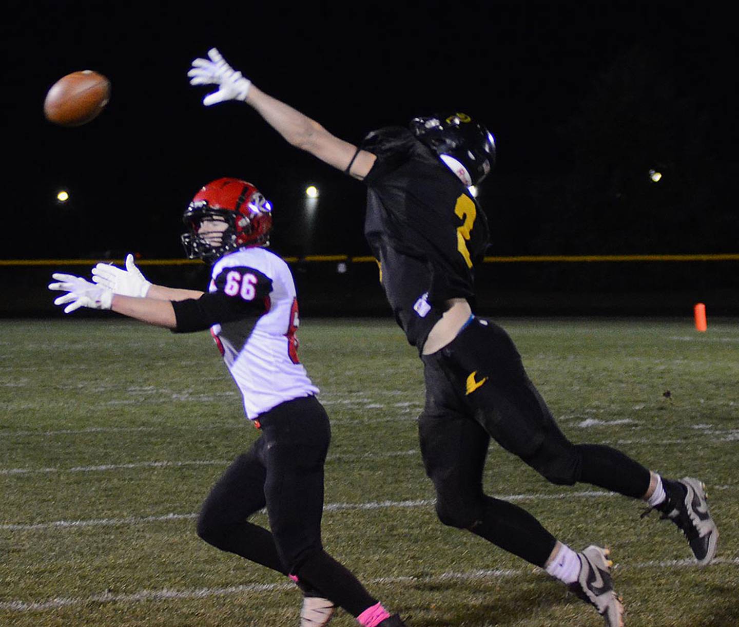 Laramie Stoaks of Lenox (2) defends a pass for Ar-We-Va's Aidan Blackman (66) that went incomplete in Friday's playoff game.