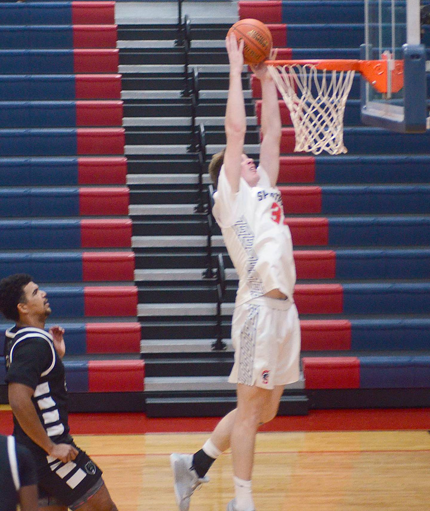 Kael Jones, Southwestern's 6-7 center from Ankeny, scored on a dunk against DMACC Saturday. Jones had 12 points in the conference opener.