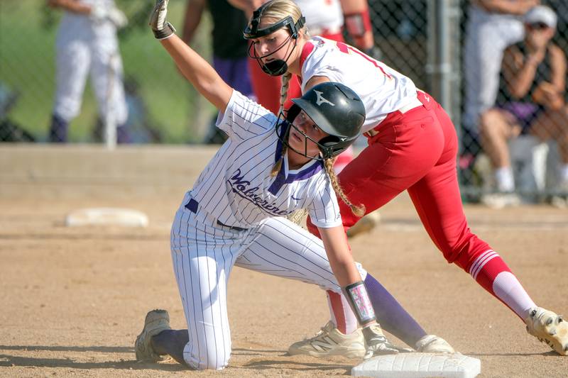 Nodaway Valley's Mattie Thompson slides safely into second base ahead of the tag by Kuemper Catholic's Kyla Wiskus during the first inning of Monday, July 7's Class 2A regional game played in Carroll. The Knights advanced with a 9-1, five-inning win.