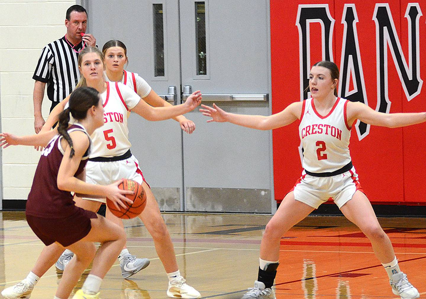 Shenandoah leading scorer Kalyn Scamman draws defensive attention from Creston's Marlee Stalker (5), Jensan Tussey and Hollynn Rieck (2). Scamman finished with 21 points in Shenandoah's 53-46 victory.