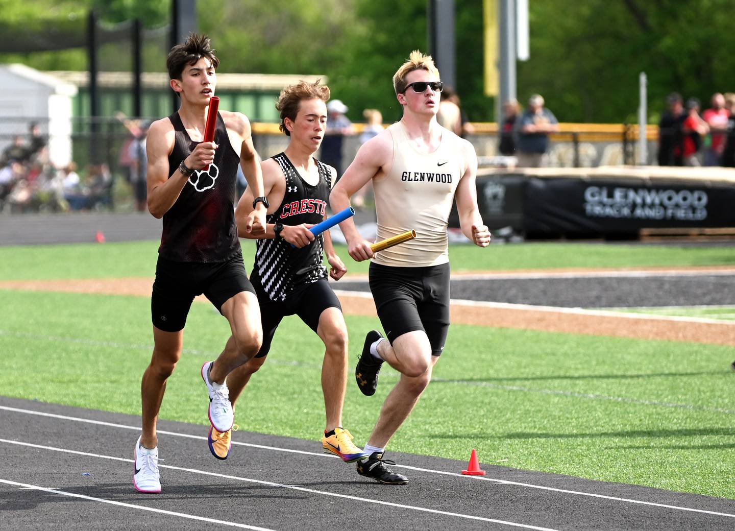 Wyatt Goodenberger keeps pace with ADM and Glenwood in the opening leg of the boys 4x800m relay
