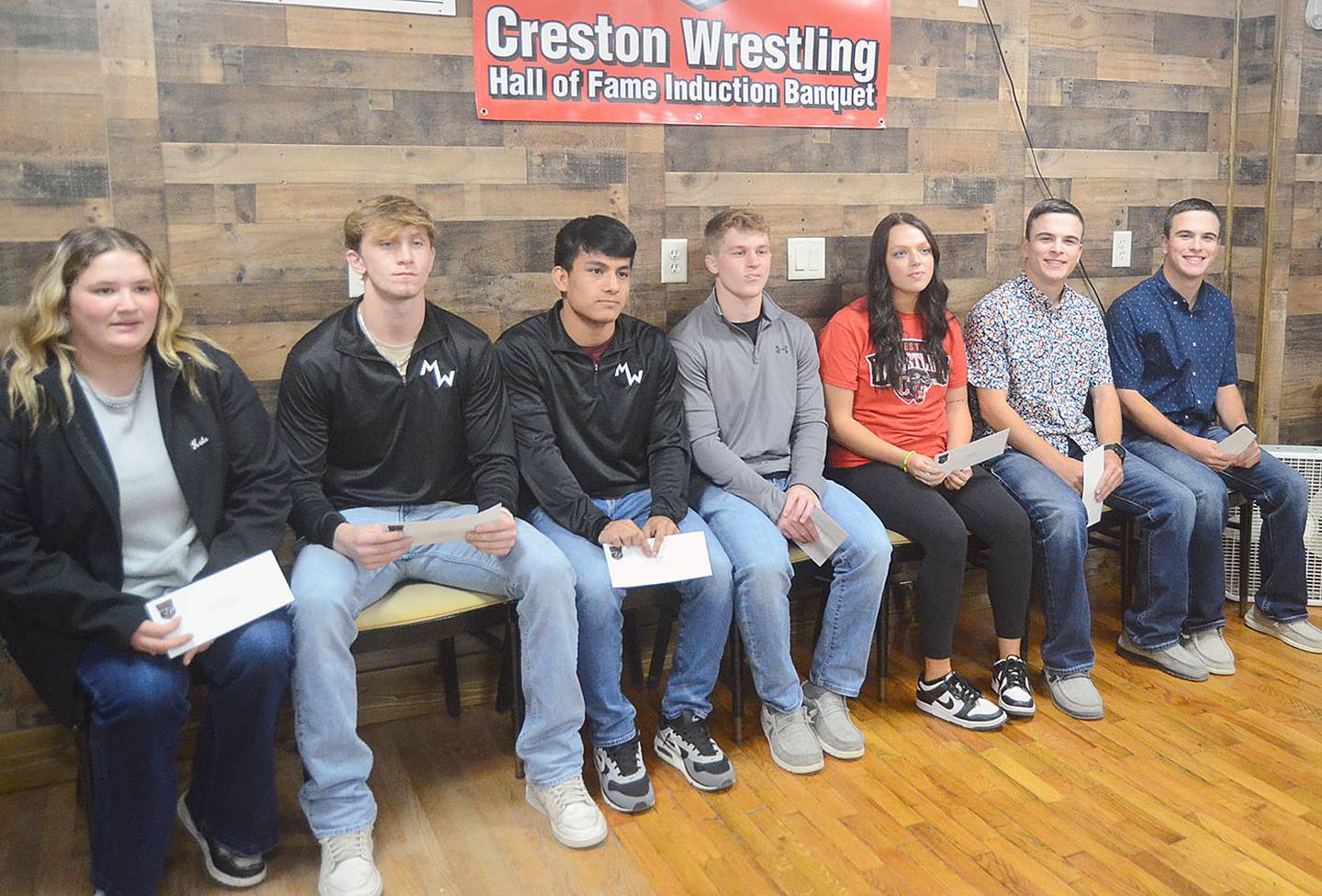 Scholarships awarded in 2023 to those seeking postgraduate education or training after four years associated with the wrestling program are, from left, Kate Foglesong, Kaden Street, Chris Aragon, Trey Chesnut, Jenna Busch, Owen Henderson and Carter Henderson.