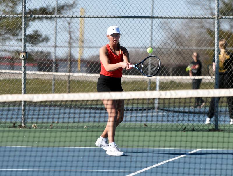 Creston No. 1 Josie Mahan returns a hit Thursday in her 8-3 win against Quincy Sorenson of Atlantic. The Panthers took a 5-4 victory in their season opener.